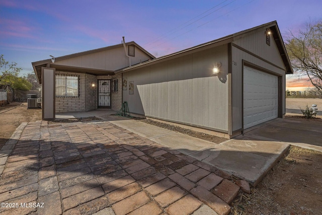 view of front of home featuring concrete driveway