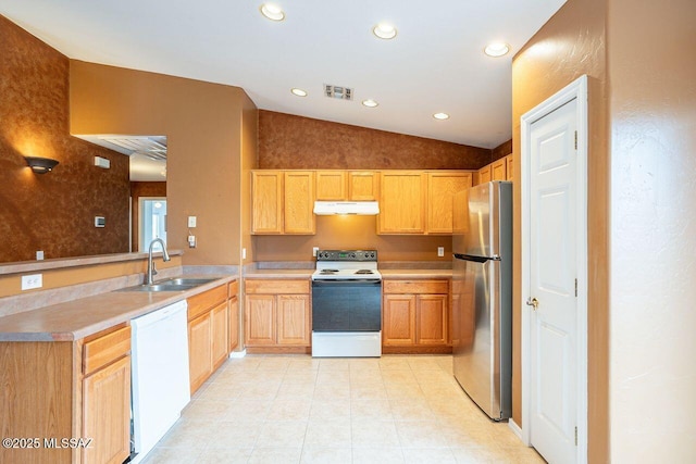 kitchen featuring visible vents, range with electric cooktop, a sink, freestanding refrigerator, and dishwasher