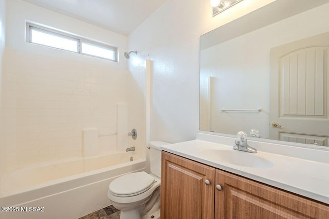 bathroom featuring shower / washtub combination, toilet, and vanity