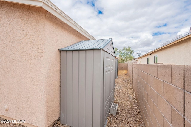 view of shed with a fenced backyard