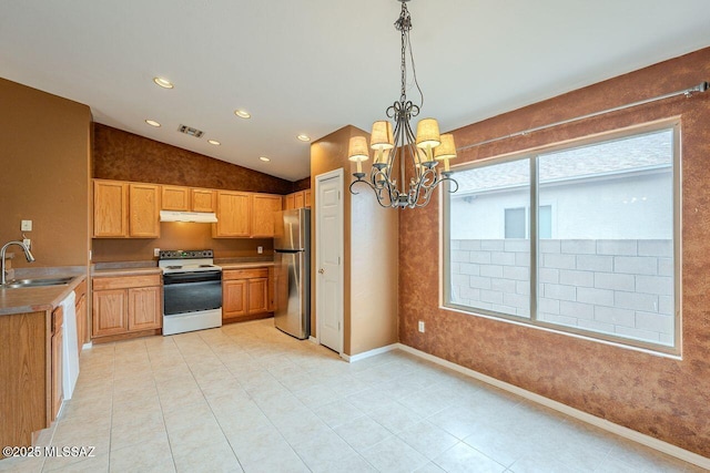 kitchen with visible vents, electric range, freestanding refrigerator, a sink, and under cabinet range hood