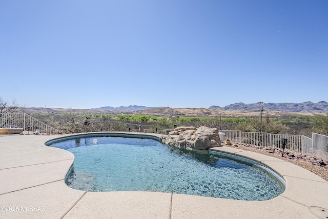 view of pool with a mountain view, a fenced in pool, and fence