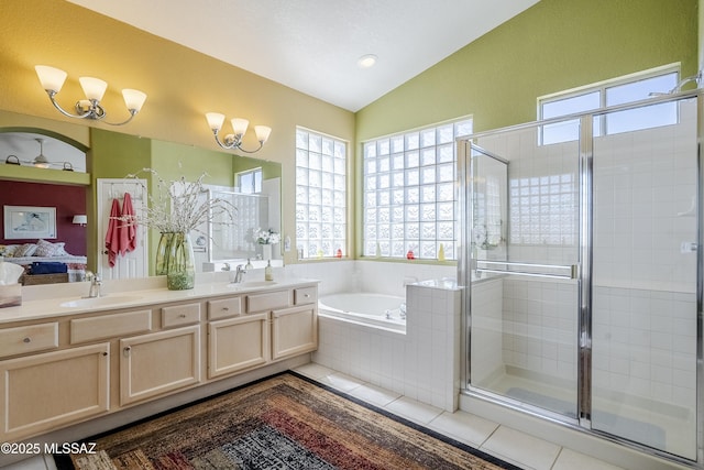 full bath with tile patterned floors, a sink, and lofted ceiling