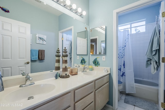 full bath featuring tile patterned flooring, shower / tub combo, a sink, and toilet