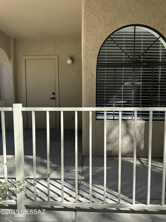 property entrance featuring stucco siding