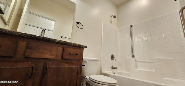 bathroom featuring vanity, toilet, and bathing tub / shower combination