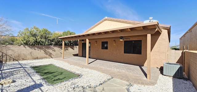 exterior space featuring stucco siding, a patio, central AC, and a ceiling fan