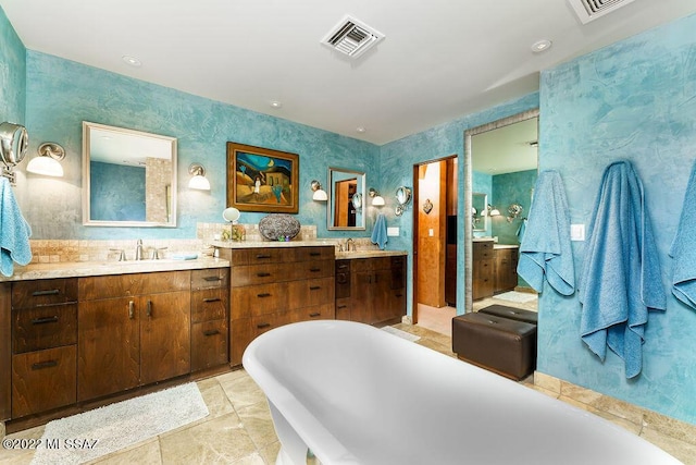 3435 E Via Guadalupe, Tucson, AZ 85716 - full bathroom with a freestanding tub, wallpapered walls, visible vents, and vanity