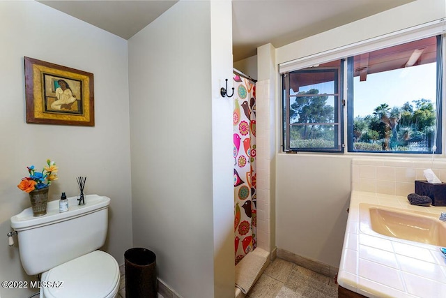 3435 E Via Guadalupe, Tucson, AZ 85716 - bathroom featuring vanity, toilet, baseboards, and a shower with curtain
