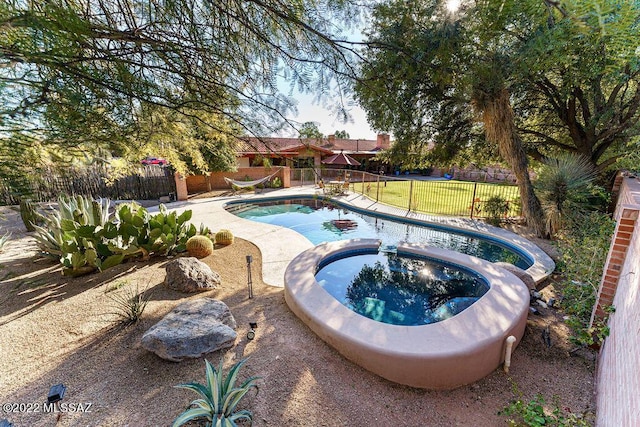 3435 E Via Guadalupe, Tucson, AZ 85716 - view of swimming pool with a fenced backyard and a pool with connected hot tub
