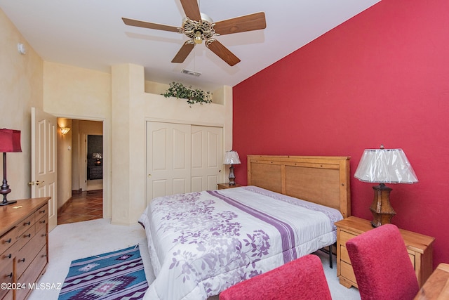 bedroom featuring a closet, visible vents, carpet flooring, and ceiling fan