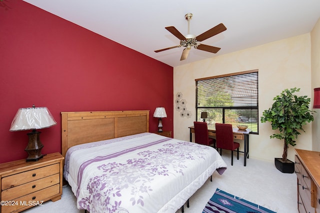 carpeted bedroom featuring baseboards and ceiling fan