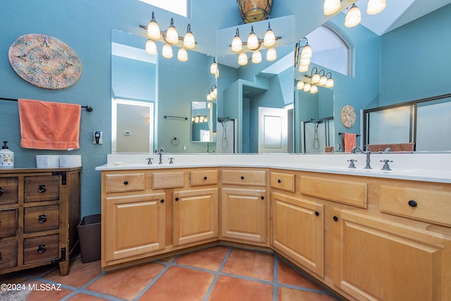 full bath featuring a stall shower, a towering ceiling, and a sink