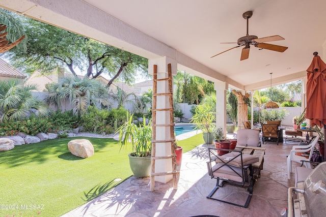 view of patio featuring outdoor dining area, a fenced in pool, ceiling fan, and fence