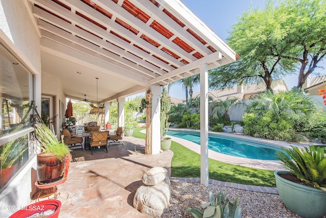 view of patio / terrace featuring a fenced in pool, outdoor dining area, and a ceiling fan