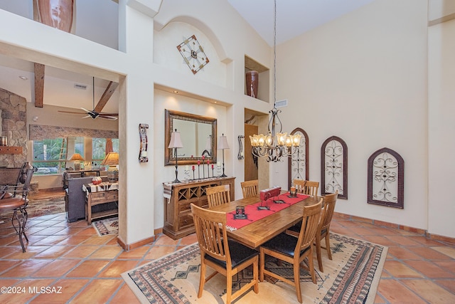 tiled dining area featuring beamed ceiling, ceiling fan with notable chandelier, a high ceiling, and baseboards