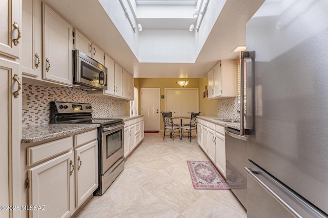 kitchen with backsplash and appliances with stainless steel finishes