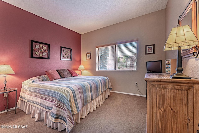 carpeted bedroom featuring a textured ceiling and baseboards