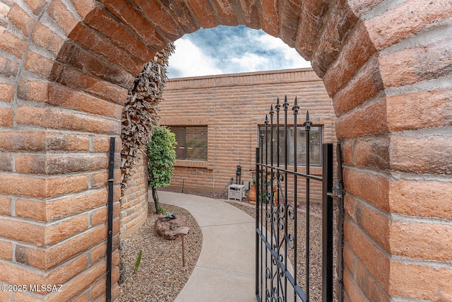 view of property exterior with a gate