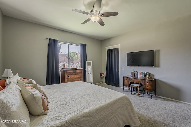 carpeted bedroom featuring a ceiling fan and baseboards