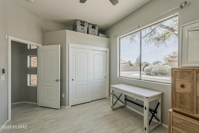 bedroom featuring a closet, baseboards, and light wood-type flooring