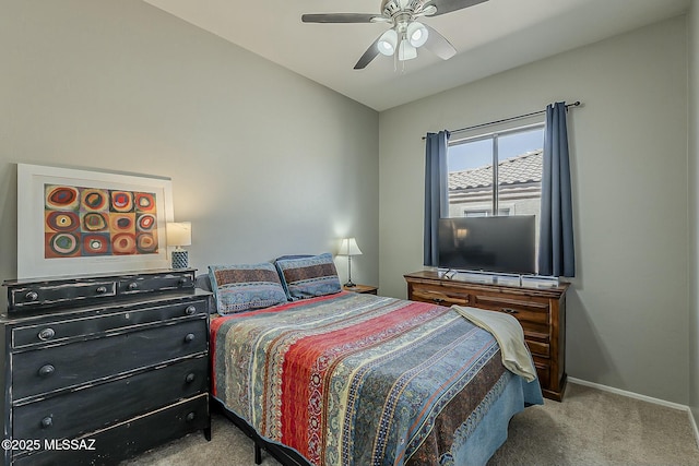 bedroom featuring a ceiling fan, carpet, lofted ceiling, and baseboards
