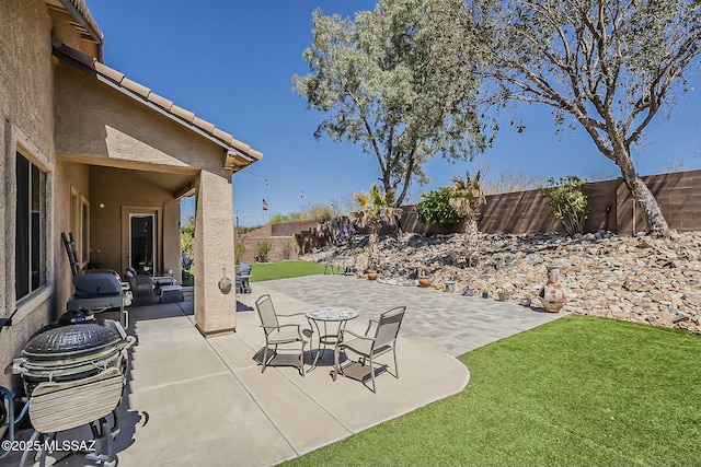 view of patio with a fenced backyard and grilling area