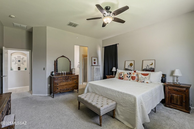 carpeted bedroom featuring baseboards, ceiling fan, and visible vents