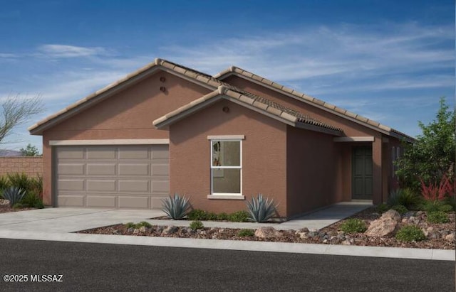 view of front of house featuring stucco siding, concrete driveway, an attached garage, and a tiled roof