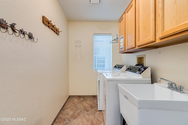 1181 W Placita Lucinda, Green Valley, AZ 85614 - laundry room with washer and clothes dryer, cabinet space, baseboards, and a sink