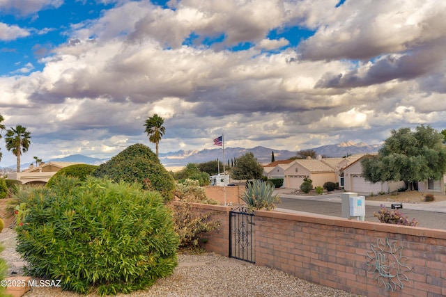1181 W Placita Lucinda, Green Valley, AZ 85614 - exterior space featuring a mountain view, fence, and a gate