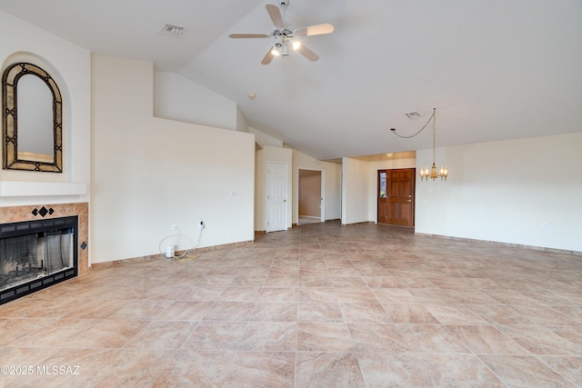 1181 W Placita Lucinda, Green Valley, AZ 85614 - unfurnished living room with visible vents, baseboards, a tiled fireplace, ceiling fan with notable chandelier, and high vaulted ceiling