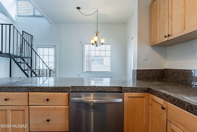 kitchen with hanging light fixtures, plenty of natural light, stainless steel dishwasher, and tile counters