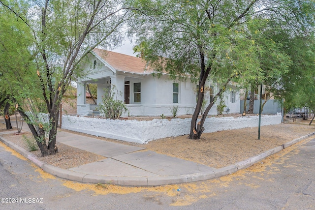 view of front of house featuring stucco siding