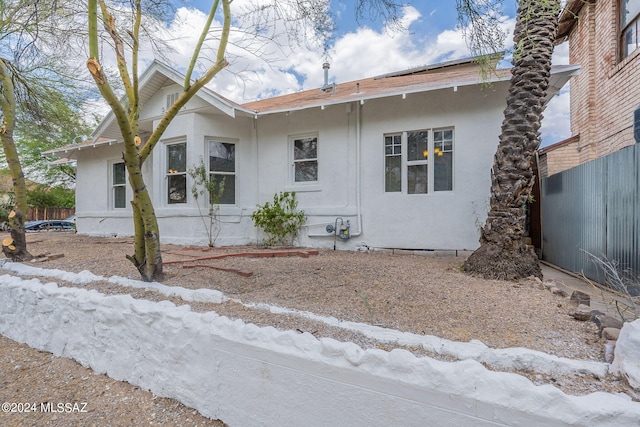 view of side of property with stucco siding