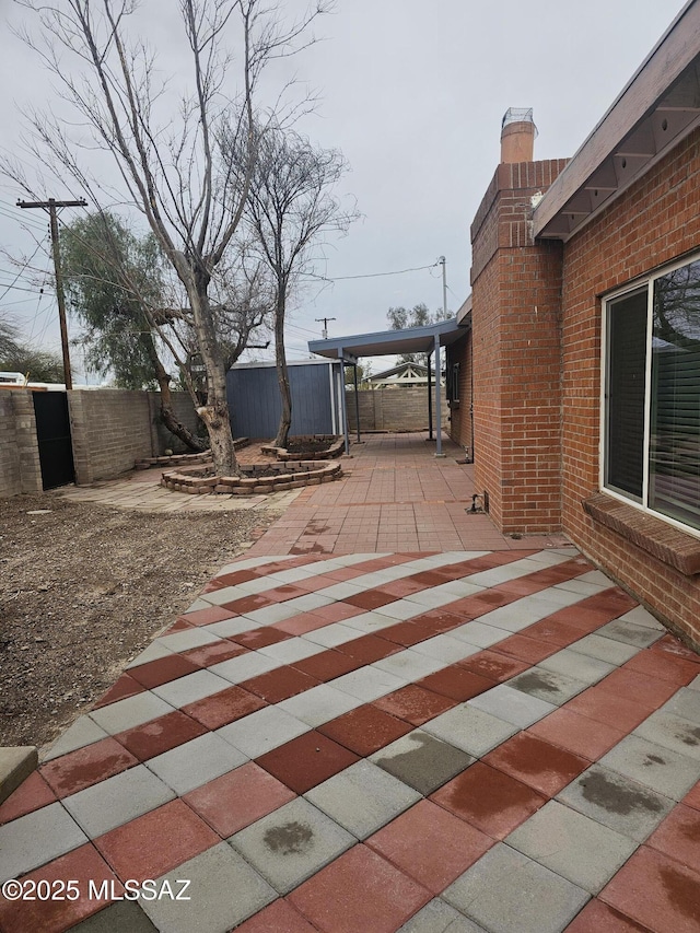 view of patio featuring fence