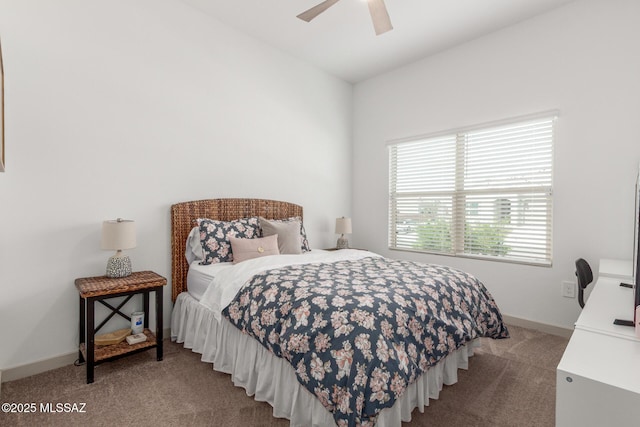 carpeted bedroom featuring a ceiling fan and baseboards