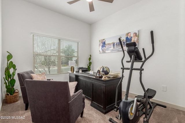 office area featuring light colored carpet, baseboards, and a ceiling fan