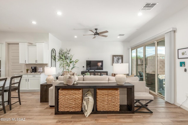 living room featuring visible vents, recessed lighting, light wood-type flooring, and ceiling fan