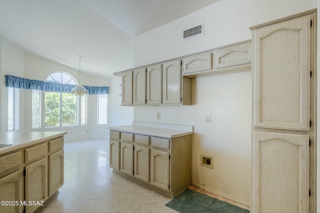 38034 S Golf Course Dr, Saddlebrooke, AZ 85739 - kitchen featuring visible vents, light floors, light brown cabinets, light countertops, and hanging light fixtures