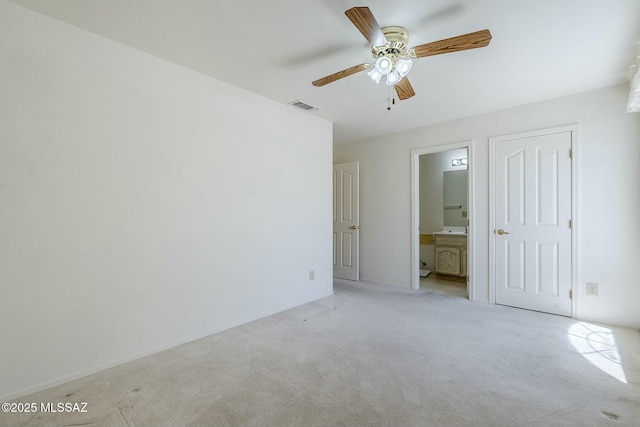 38034 S Golf Course Dr, Saddlebrooke, AZ 85739 - unfurnished bedroom with ceiling fan, visible vents, connected bathroom, and light colored carpet