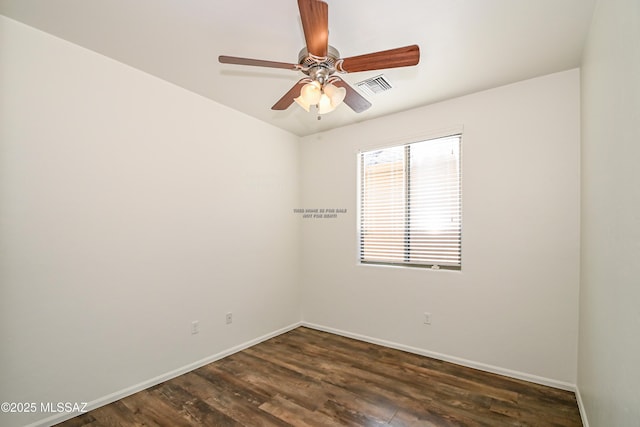 unfurnished room featuring ceiling fan, dark wood-style floors, visible vents, and baseboards