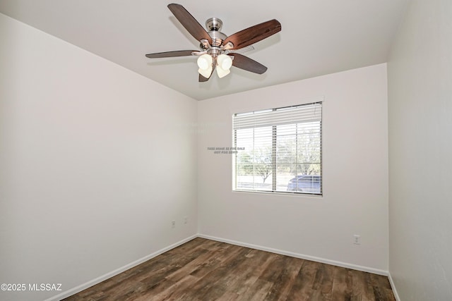 spare room with baseboards, wood finished floors, and a ceiling fan