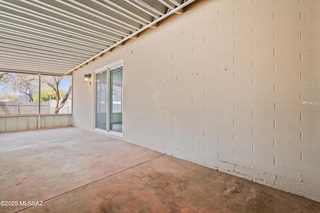 view of patio featuring fence