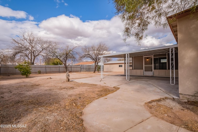 view of yard featuring a patio area and a fenced backyard