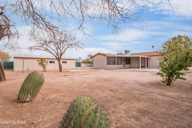 view of yard with a patio and a sunroom