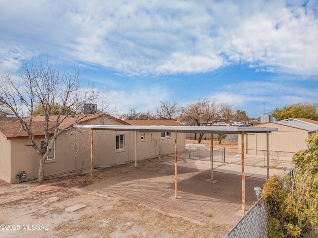 exterior space with fence and stucco siding