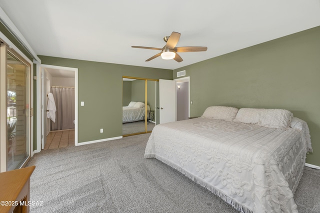 carpeted bedroom featuring ceiling fan, visible vents, a closet, and baseboards