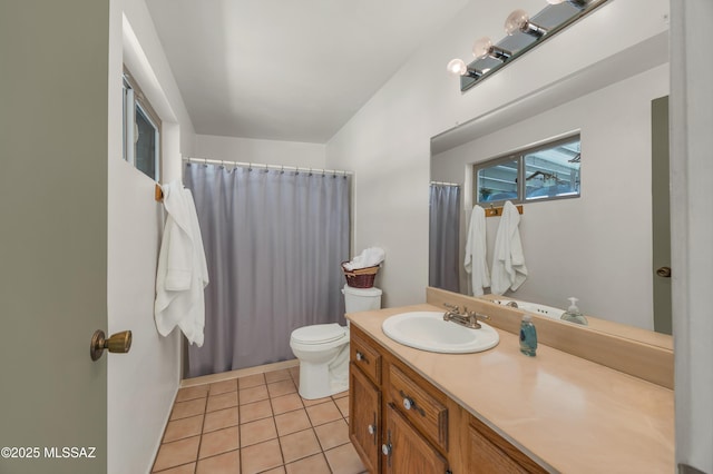 bathroom featuring tile patterned floors, toilet, a shower with shower curtain, and vanity