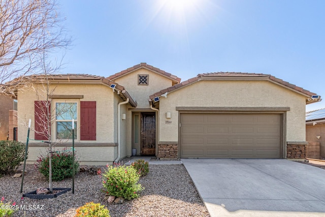 view of front of home with stone siding, a garage, driveway, and stucco siding